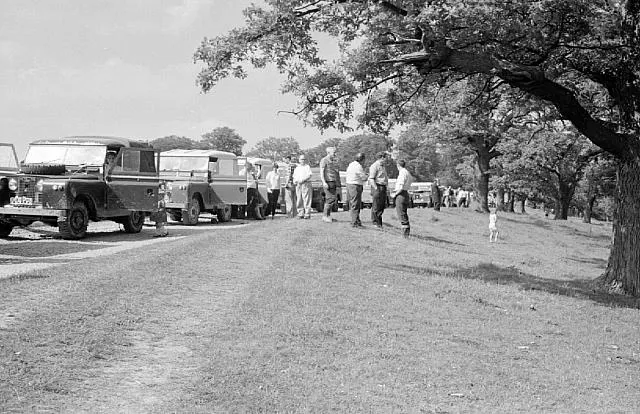 Series Land Rovers parked along a ridge at Eastnor in the 1970s