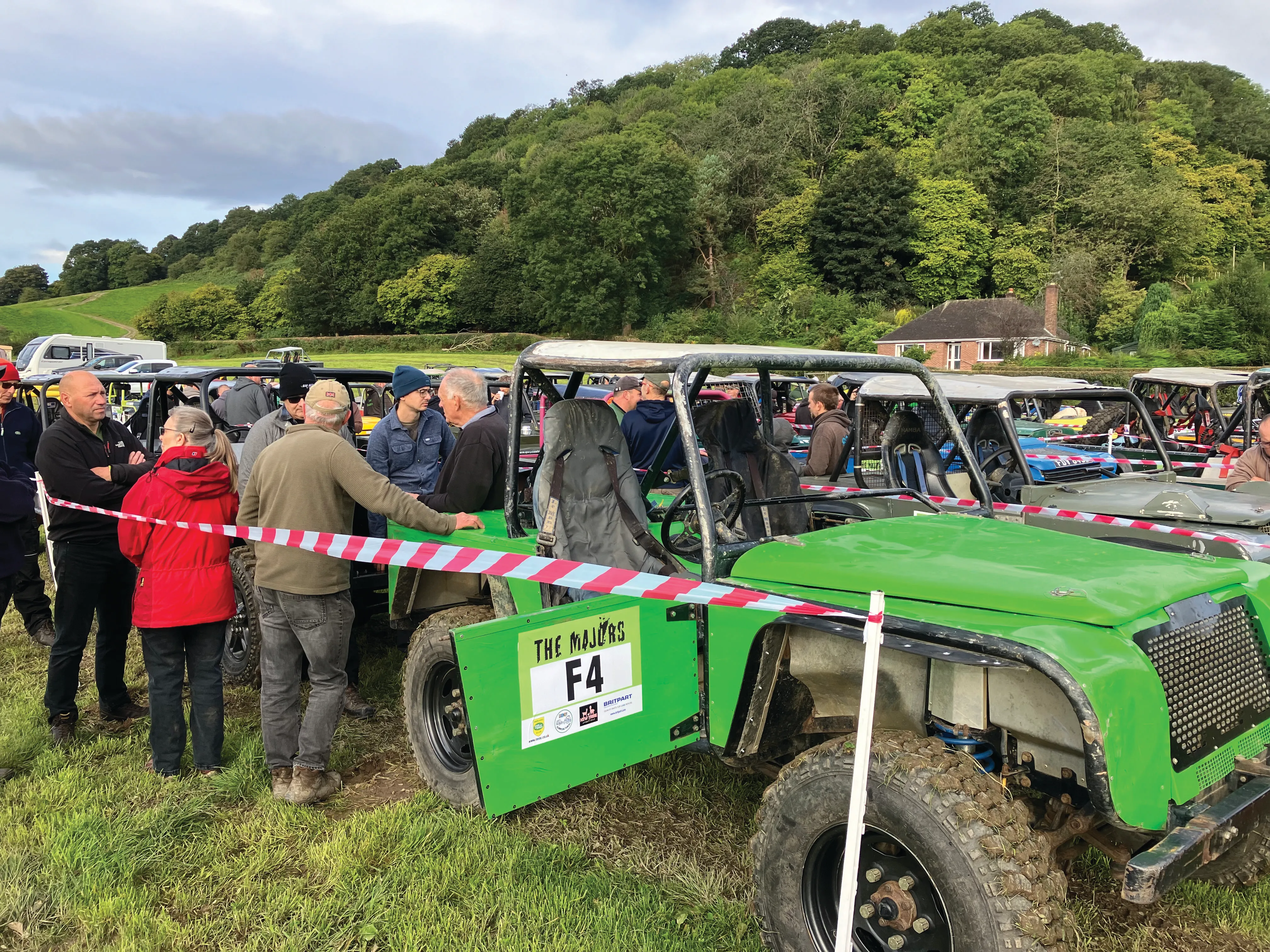 A Land Rover climbing a steep muddy section at the Majors trial